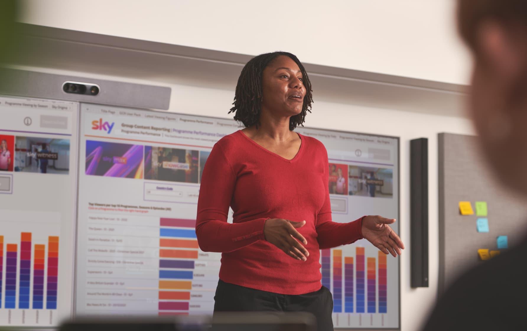 woman presenting in front of screen
