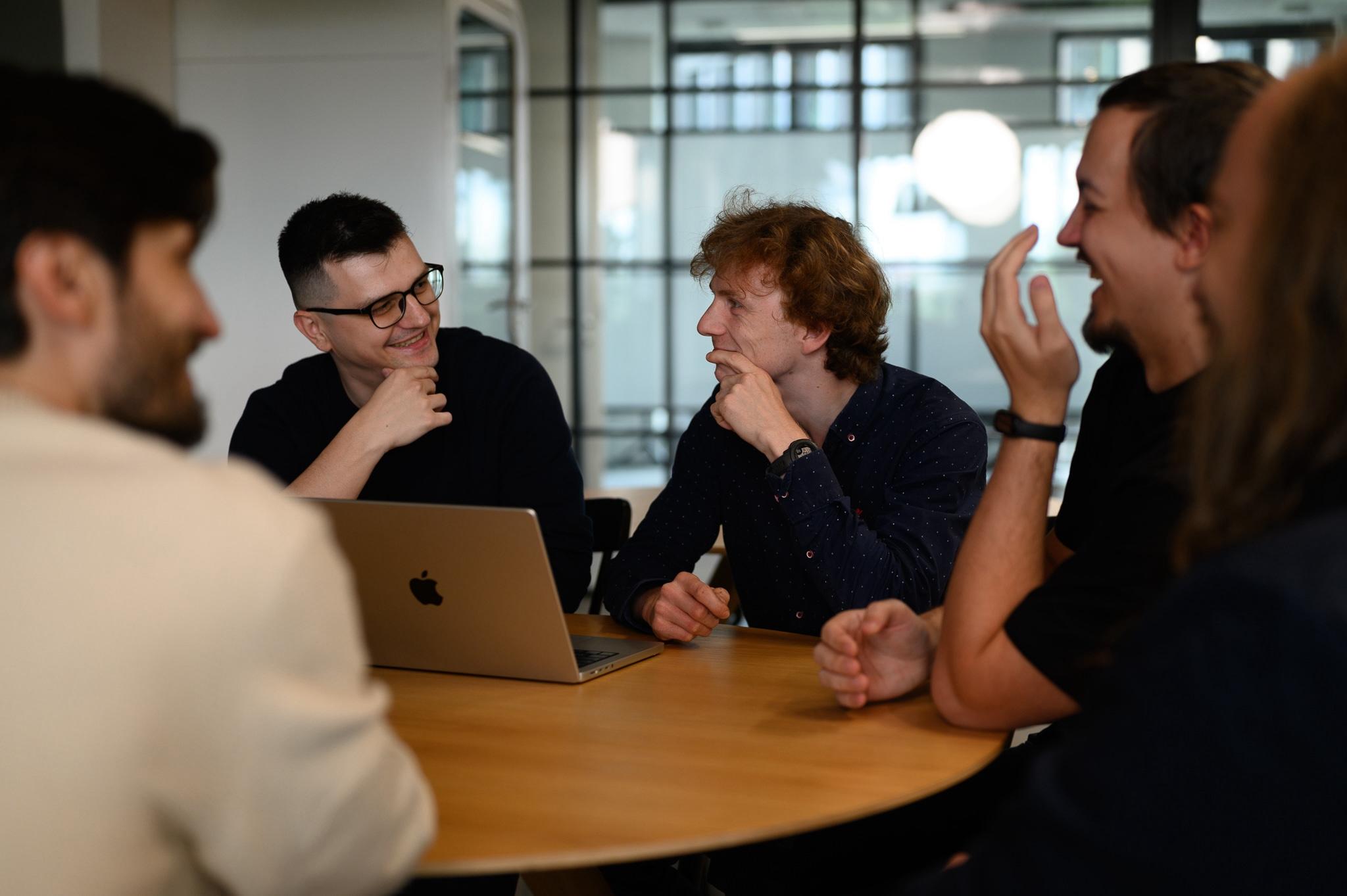 Team at a meeting in the kitchen