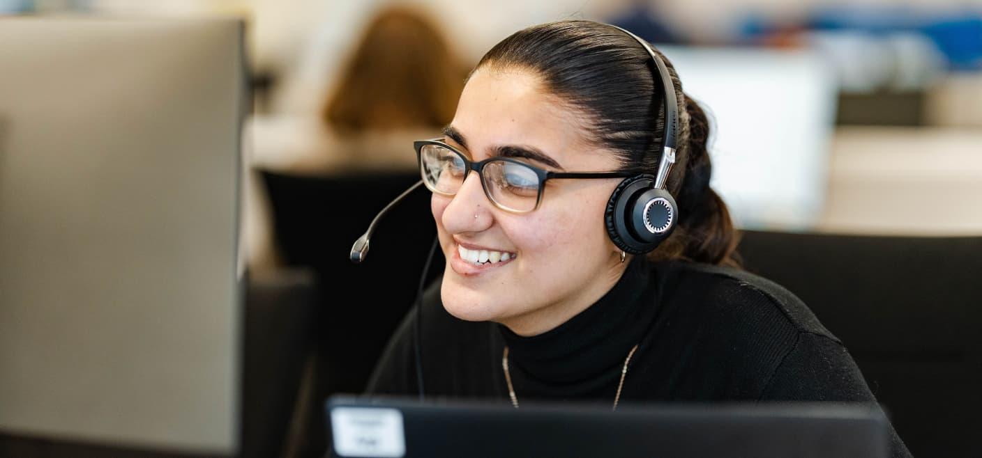 woman in headset smiling