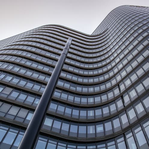 upwards angled shot of glass building