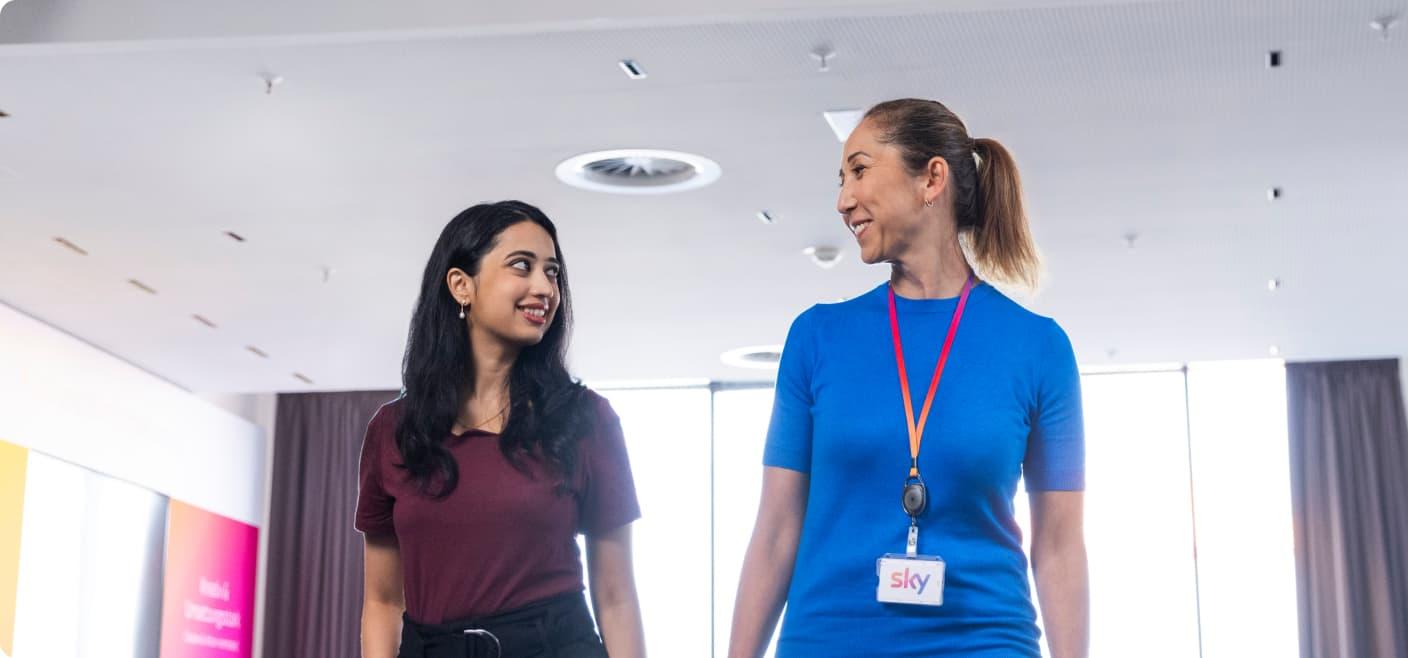 two female colleagues in conversation with each other