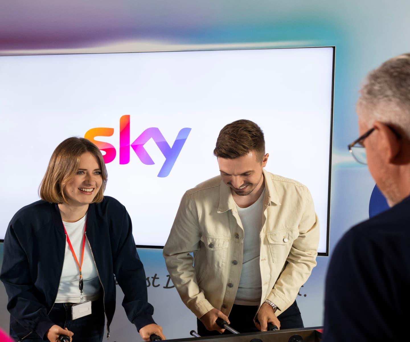 people in the Sky office playing table football